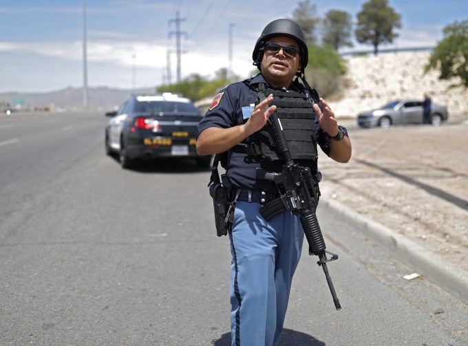 An armed officer at the Walmart shooting scne
