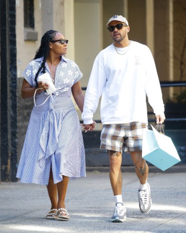 New York City, NY  - *EXCLUSIVE*  - Jesse Williams is spotted during a rare outing with longtime girlfriend Ciarra Pardo after having lunch together at Cipriani Downtown NYC in SoHo, New York City on Tuesday. The actor currently starring on Broadway's Take me Out cut a casual figure in plaid shorts that showed off what appeared to be a new eagle tattoo on his leg and a white crew topped with a baseball cap. Pardo, who is CEO at Mi Ojo + Co-Founder of LevelN4XT and counts Rihanna as a friend having served as Chief Creative Officer at Fenty Corp looked summer ready in a seersucker dress with embroidered flower details and tied just beneath her chest and paired it with pear accent sandals. The couple were seen checkin their phones during al fresco lunch and chatting closely before heading off hand in hand.Pictured: Jesse WilliamsBACKGRID USA 15 JUNE 2022 BYLINE MUST READ: Fernando Ramales / BACKGRIDUSA: +1 310 798 9111 / usasales@backgrid.comUK: +44 208 344 2007 / uksales@backgrid.com*UK Clients - Pictures Containing ChildrenPlease Pixelate Face Prior To Publication*