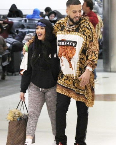 Miami, FL  - *EXCLUSIVE*  - French Montana arrives to Miami with a mystery girlfriend. The duo seem close as French is even seen letting his hand wander to her rear as they walk through the airport after their flight.

Pictured: French Montana

BACKGRID USA 29 JANUARY 2020 

BYLINE MUST READ: NGRE / BACKGRID

USA: +1 310 798 9111 / usasales@backgrid.com

UK: +44 208 344 2007 / uksales@backgrid.com

*UK Clients - Pictures Containing Children
Please Pixelate Face Prior To Publication*
