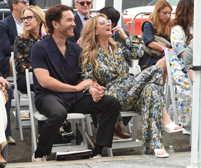 Kaley Cuoco and Tom Pelphrey sitting