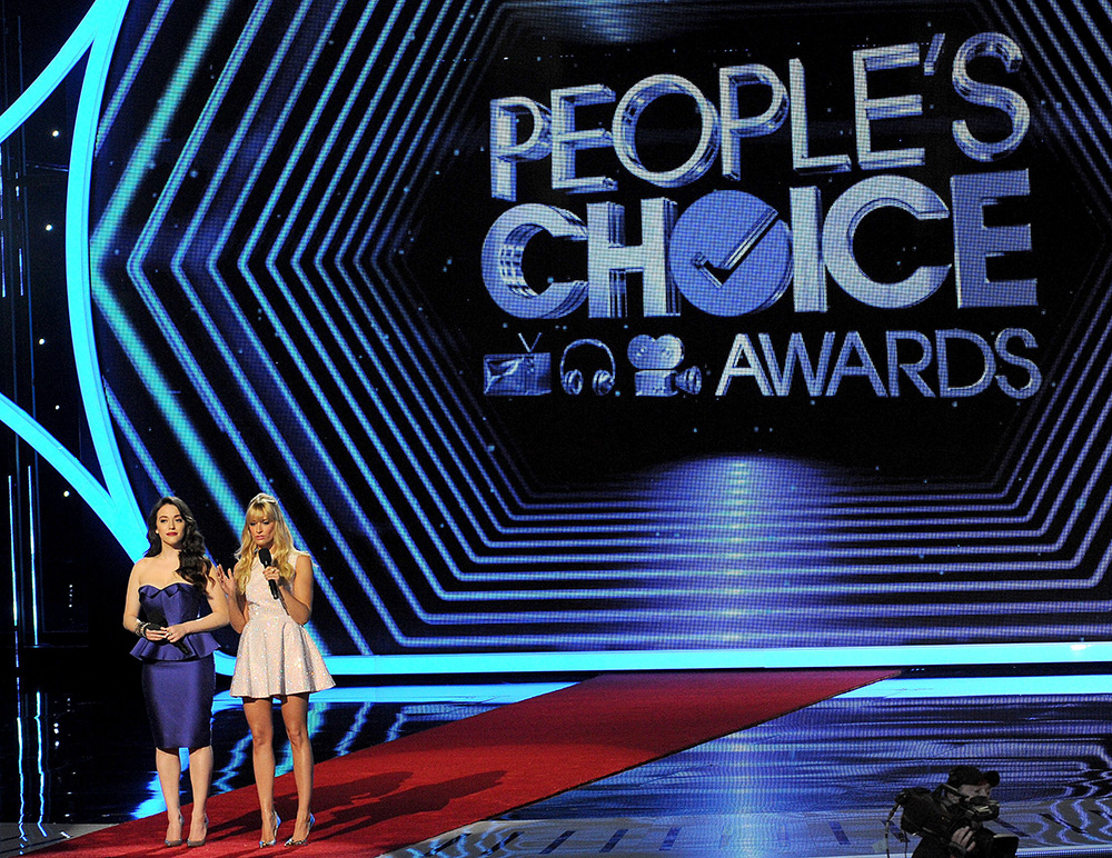 From left, hosts Kat Dennings and Beth Behrs speak onstage at the 40th annual People's Choice Awards at Nokia Theatre L.A. Live, in Los Angeles
2014 People's Choice Awards - Show, Los Angeles, USA - 8 Jan 2014