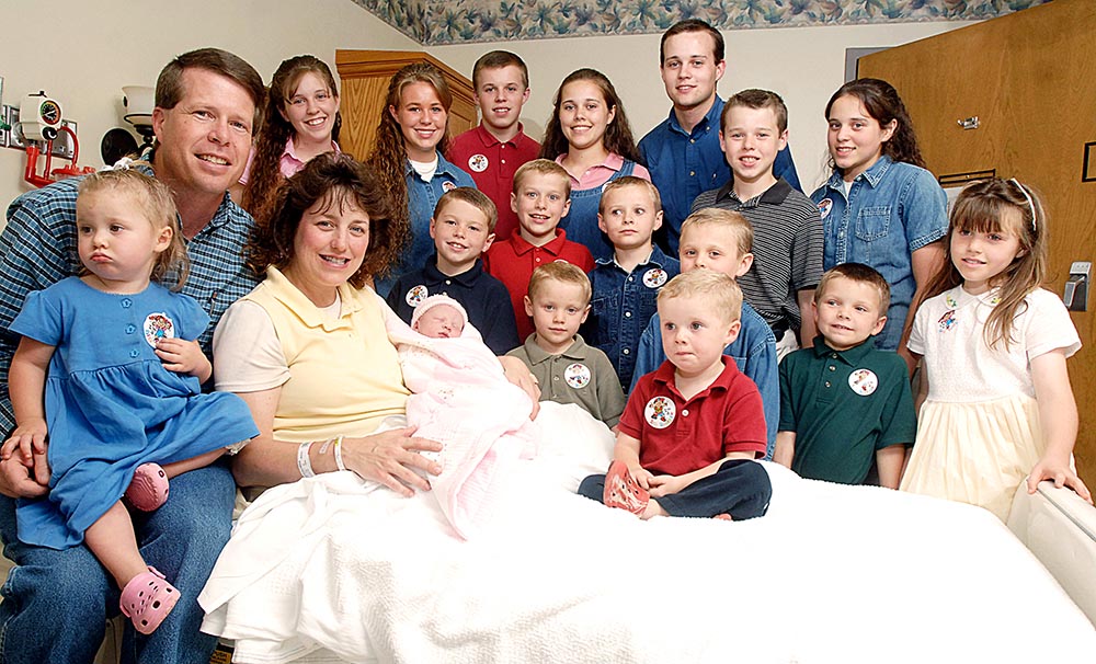 Michelle Duggar, left, is surrounded by her children and husband Jim Bob, second from left, after the birth of her 17th child in Rogers, Ark. From the rubble of TLC's canceled "19 Kids and Counting" now rises "Jill and Jessa: Counting On." The three specials will air Dec. 13, 20 and 27 the TLC network announced . These specials focus on Jill (Duggar) Dillard as she moves to Central America with her family for missionary work and Jessa (Duggar) Seewald starts a family of her own
TV Duggar Sisters Specials, Rogers, USA