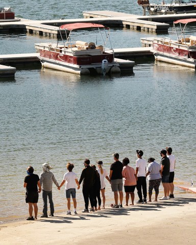 Cast members, including Heather Morris, from the TV Show "Glee" and friends held hands as they shouted "Say her name - Naya" as they gathered on the Lake Piru boat launch Monday morning just as Ventura County Sheriff's Search and Rescue dive team located a body Monday morning in Lake Piru as the search continued for 33-year-old "Glee" actress Naya Rivera after her 4-year-old son was found alone on a boat she rented last Wednesday. Rivera rented the pontoon boat and had been swimming with her son who was the last one to see her before she went missing. The boy got back into the boat after a swim but his mother did not follow. Lake Piru on Monday
Cast members from the show "Glee" and friends gathered Monday morning at the boat launch as Ventura County Sheriff's Search and Rescue dive team located a body Monday morning in Lake Piru as the search continued for actress Naya Rivera after her 4-year-old