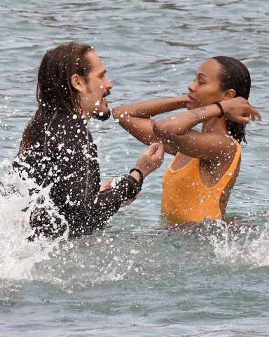 Sardinia, ITALY  - *EXCLUSIVE*  - Actress Zoe Saldana with her husband Marco Perego and their children, enjoy a swim in the Pevero beach in Sardinia, before getting back on their yacht and continuing the cruise in the beautiful Italian seas.

Zoe looked sexy showing off her figure wearing her striking orange swimsuit.

Pictured: Zoe Saldana

BACKGRID USA 23 JULY 2023 

BYLINE MUST READ: FREZZA LA FATA - COBRA TEAM / BACKGRID

USA: +1 310 798 9111 / usasales@backgrid.com

UK: +44 208 344 2007 / uksales@backgrid.com

*UK Clients - Pictures Containing Children
Please Pixelate Face Prior To Publication*