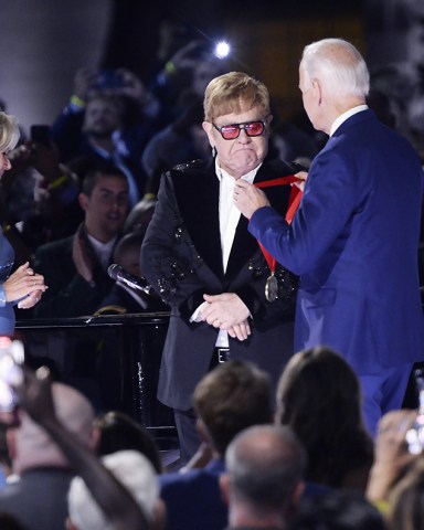 United States President Joe Biden presents Sir Elton John with the National Humanities Medal after he preformed a show called "A Night When Hope and History Rhyme" as part of his farewell tour on the South Lawn of the White House in Washington, DC on Friday, September 23, 2022.
Elton John Preforms on the South Lawn of the White House, Washington, District of Columbia, USA - 23 Sep 2022