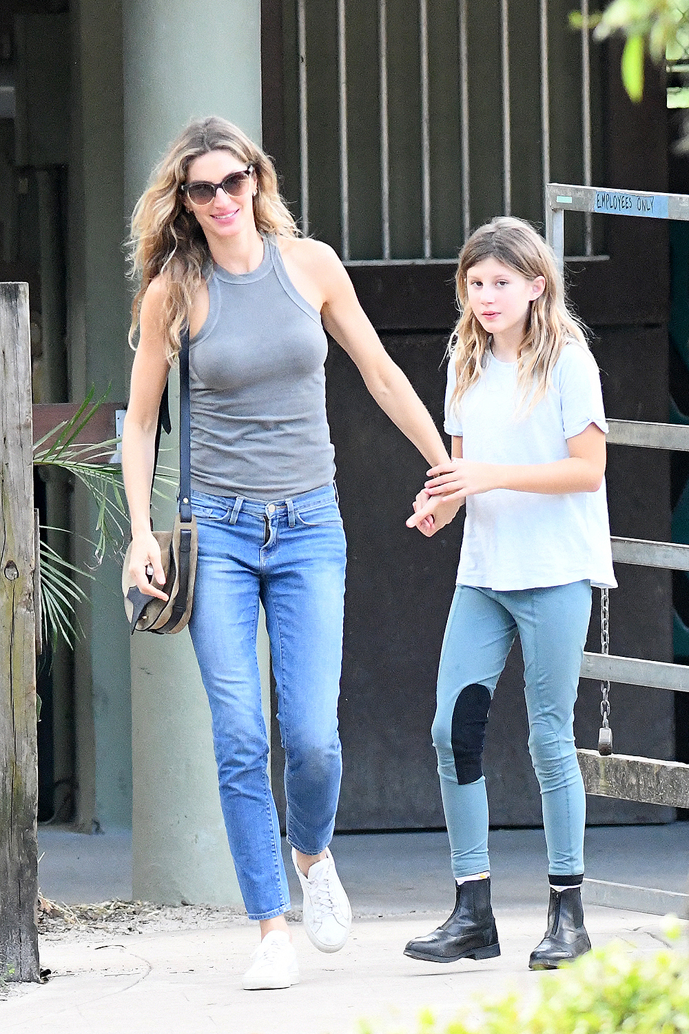 EXCLUSIVE: Newly single Gisele Bundchen looks happy as she takes her daughter Vivian to a riding lesson in Miami