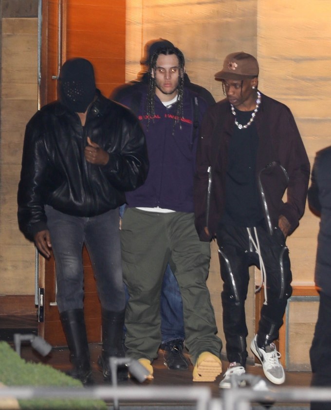 Kanye West with Travis Scott and other rappers at the ‘Donda 2’ listening party