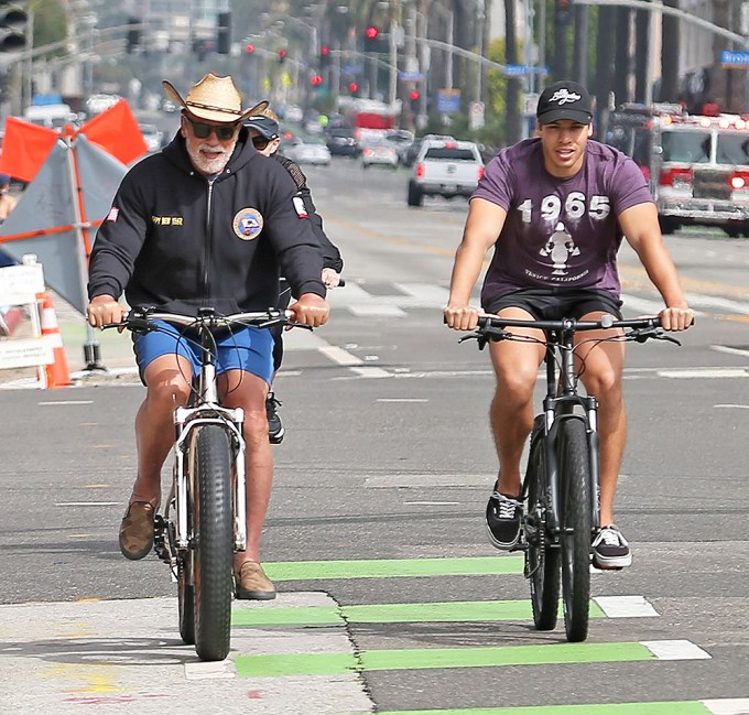 Arnold Schwarzenegger bike riding with his son Joseph Baena