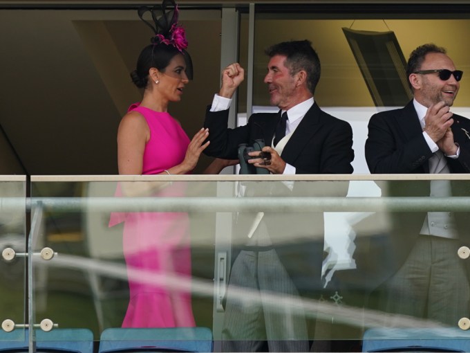 Simon Cowell & Lauren Silverman at an event