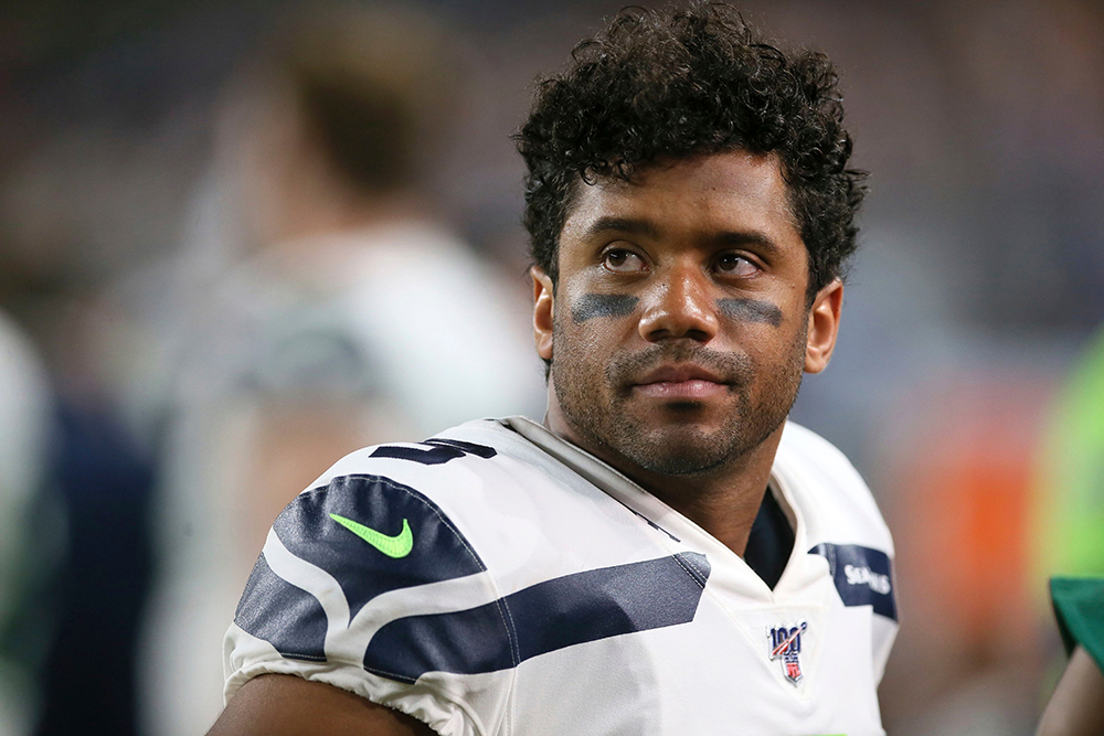 Seattle Seahawks quarterback Russell Wilson watches from the bench during the second half of an NFL preseason football game against the Minnesota Vikings, in Minneapolis
Seahawks Vikings Football, Minneapolis, USA - 18 Aug 2019