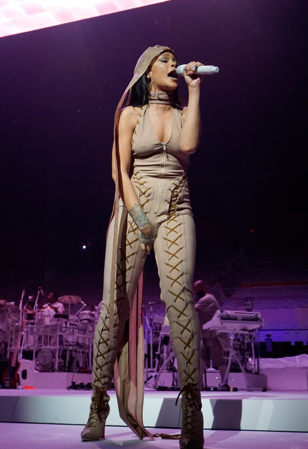 Rihanna goes braless in a sheer bodysuit as she twerks on stage with Drake during a performance of their hit single "Work" as part of the Anti World Tour in Miami