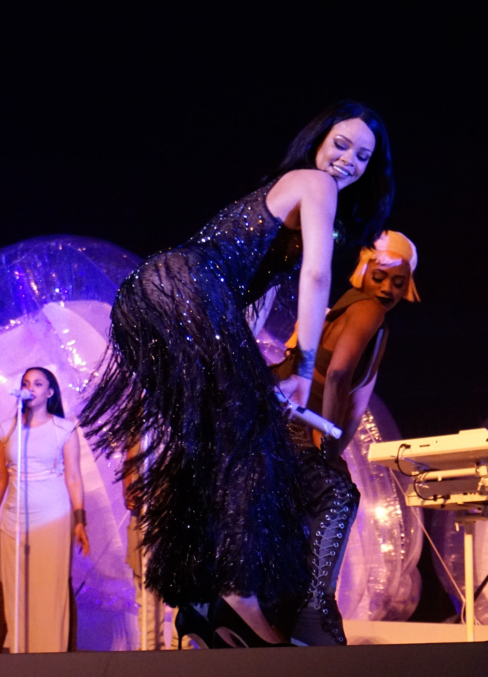 Rihanna goes braless in a sheer bodysuit as she twerks on stage with Drake during a performance of their hit single "Work" as part of the Anti World Tour in Miami