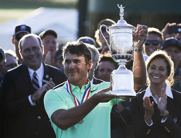 Copyright 2017 The Associated Press. All rights reserved. This material may not be published, broadcast, rewritten or redistributed without permission.Mandatory Credit: Photo by AP/REX/Shutterstock (8872026fg)Brooks Koepka holds up the winning trophy after the U.S. Open golf tournament, at Erin Hills in Erin, WisUS Open Golf, Erin, USA - 18 Jun 2017