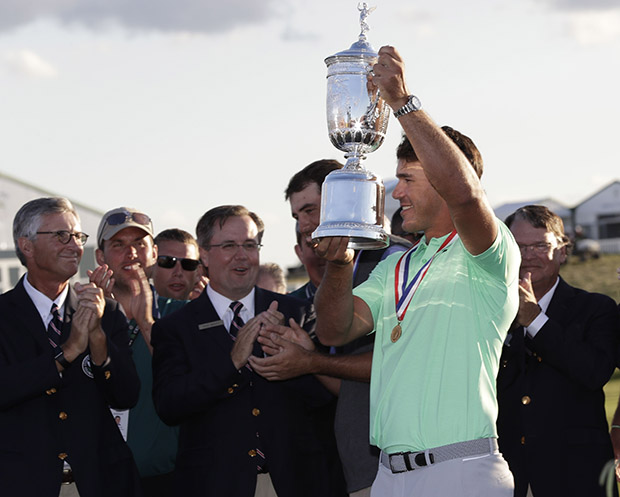 Copyright 2017 The Associated Press. All rights reserved. This material may not be published, broadcast, rewritten or redistributed without permission.Mandatory Credit: Photo by AP/REX/Shutterstock (8872026fh)Brooks Koepka holds up the winning trophy after the U.S. Open golf tournament, at Erin Hills in Erin, WisUS Open Golf, Erin, USA - 18 Jun 2017