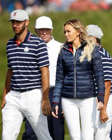 Dustin Johnson of the US, left, walks with his partner Paulina Gretzky on 16th green at the end of a fourball match on the opening day of the 42nd Ryder Cup at Le Golf National in Saint-Quentin-en-Yvelines, outside Paris, France, . Johnson and Fowler won 4 and 2 over Europe's Rory McIlroy and Thorbjorn Olesen
Ryder Cup Golf, Saint-Quentin-en-Yvelines, France - 28 Sep 2018