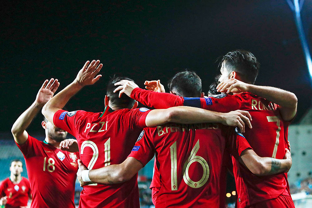 Portugal's Cristiano Ronaldo, right, celebrates with teammates after scoring his side's second goal during the Euro 2020 group B qualifying soccer match between Portugal and Lithuania at the Algarve stadium outside Faro, Portugal
Lithuania Euro 2020 Soccer, Faro, Portugal - 14 Nov 2019