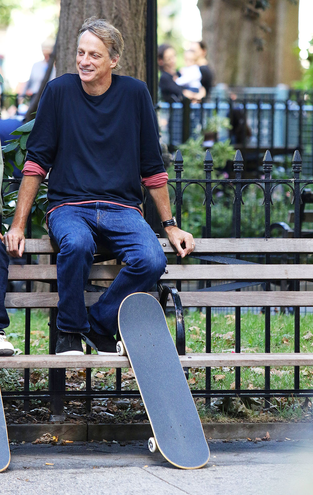 Tony Hawk Sits On A Park Bench While Filming An Untitled Project In NYC