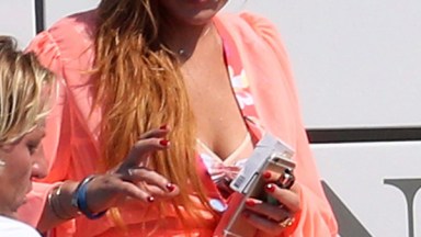 Lindsay Lohan Wears A Bikini & Smokes