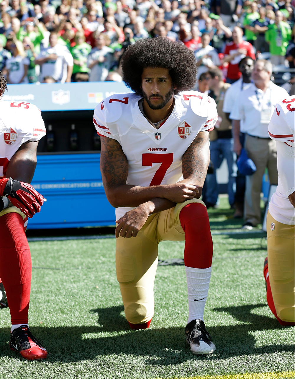 San Francisco 49ers' Colin Kaepernick kneels during the national anthem before an NFL football game against the Seattle Seahawks in Seattle. The same guys who banished Kaepernick from the league for kneeling during the anthem to raise awareness about those very same issues have ruthlessly commandeered his cause
Paul Newberry The Kaepernick Effect, Seattle, USA - 25 Sep 2016