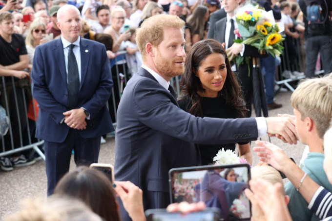 Prince Harry & Meghan Markle greet mourners