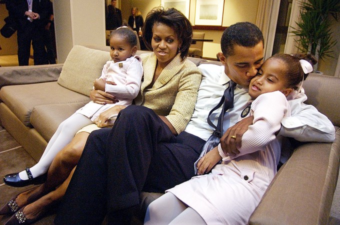 Barack & Michelle Obama Cuddle with Their Daughters