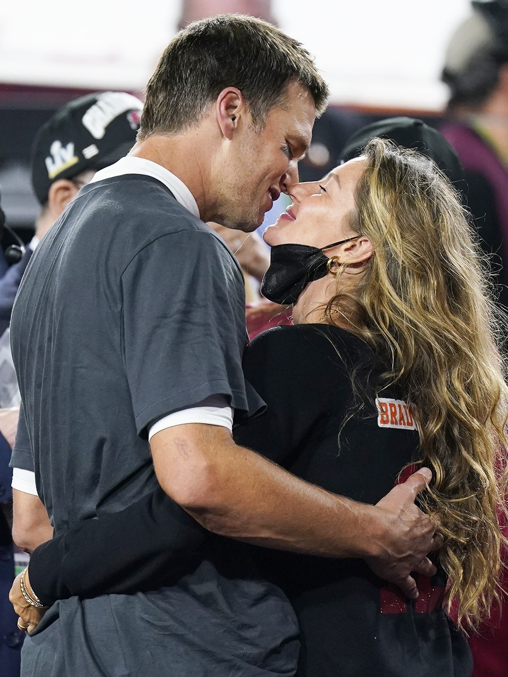 Tampa Bay Buccaneers quarterback Tom Brady kisses wife Gisele Bundchen after defeating the Kansas City Chiefs in the NFL Super Bowl 55 football game Sunday, Feb. 7, 2021, in Tampa, Fla. The Buccaneers defeated the Chiefs 31-9 to win the Super Bowl. (AP Photo/Mark Humphrey)