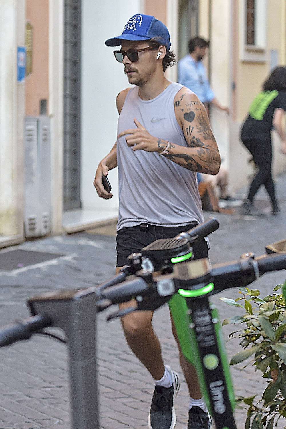 EXCLUSIVE: *NO WEB UNTIL 2330 BST 1ST AUG* Harry Styles sports new facial hair while jogging in Rome