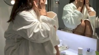 Bella Hadid Using Face Oils In Her Bathrobe