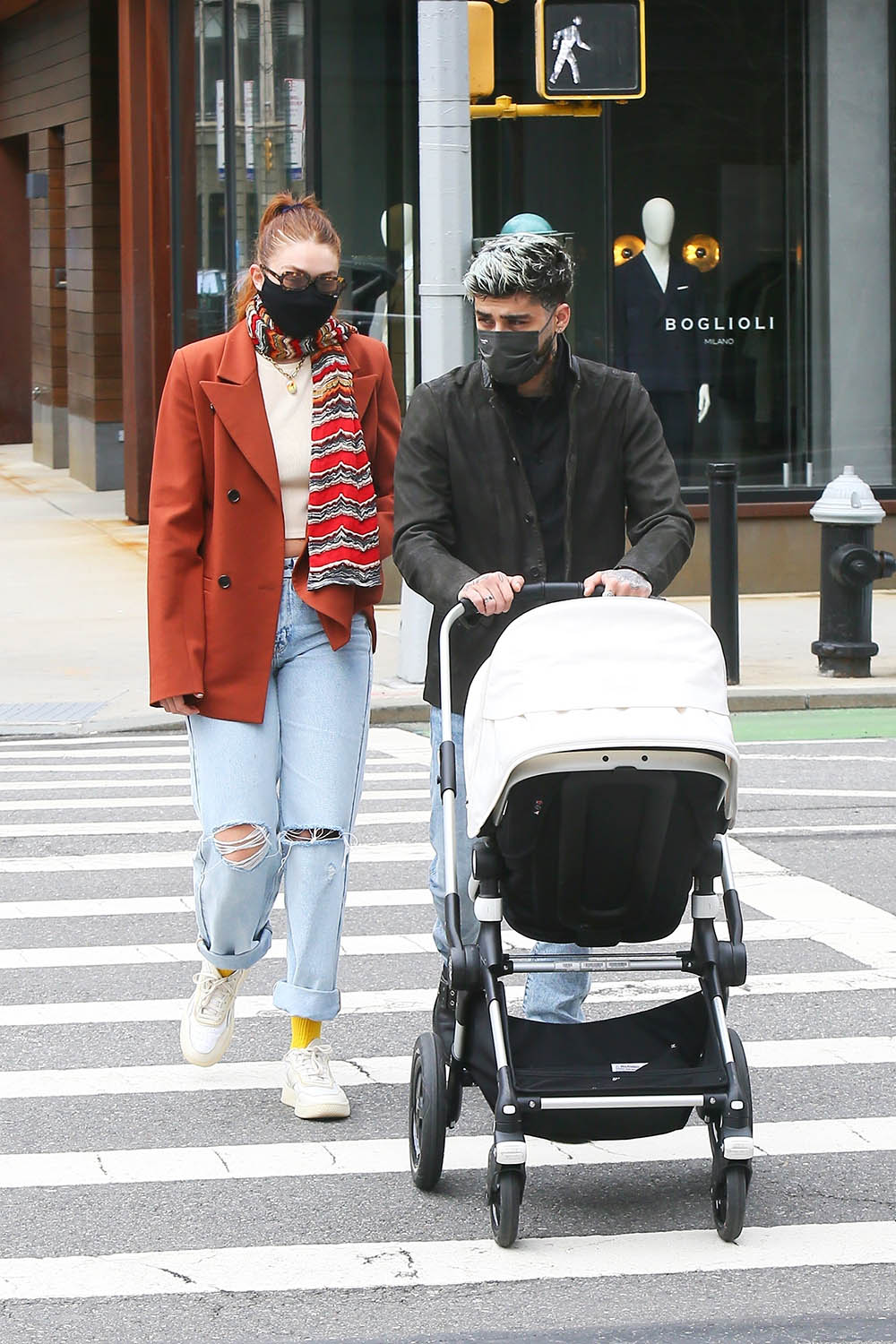 Gigi Hadid and Zayn Malik show off their impressive couple style on a walk with daughter Khai