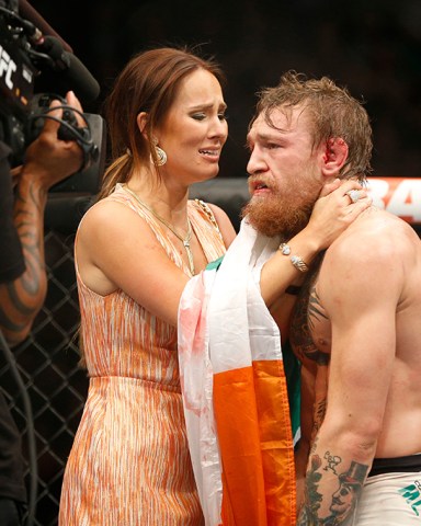 Conor McGregor celebrates with girlfriend Dee Devlin after defeating Chad Mendes during their interim featherweight title mixed martial arts bout at UFC 189, in Las Vegas
UFC 189 Mixed Martial Arts, Las Vegas, USA