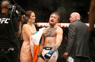 Conor McGregor celebrates with girlfriend Dee Devlin after defeating Chad Mendes during their interim featherweight title mixed martial arts bout at UFC 189, in Las Vegas
UFC 189 Mixed Martial Arts, Las Vegas, USA