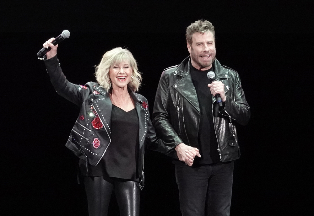 John Travolta and Olivia Newton John recreate their iconic Grease characters in full costume at a ‘Meet ‘N Grease’ sing-a-long in West Palm Beach