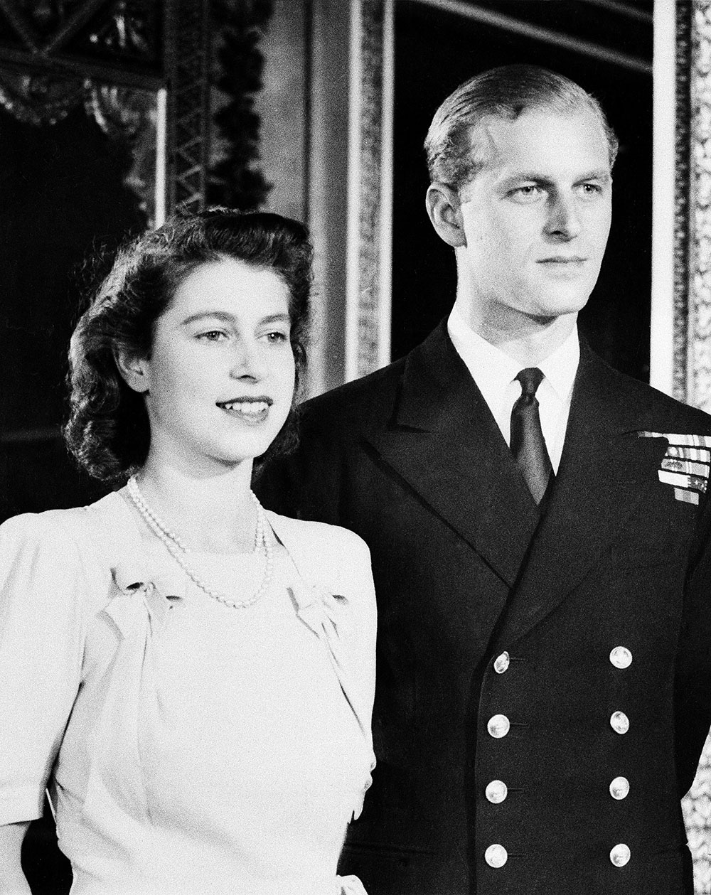 Britain's Princess Elizabeth and her fiance Lieut. Philip Mountbatten pose for camera on September 17, 1947 in White Drawing Room of Buckingham Palace in London in connection with their wedding.   The royal couple will marry on November 20, 1947.    (AP Photo)