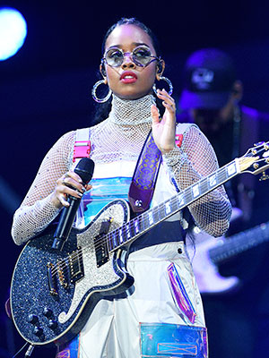 H.E.R. performing on stage