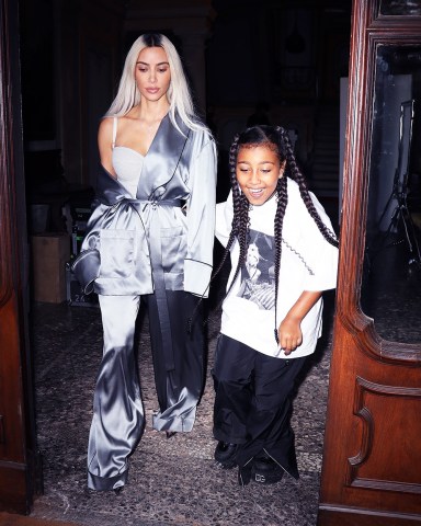 Milan, ITALY - *EXCLUSIVE* - Kim Kardashian and daughter North West take off from the set of a photoshoot in Milan. Kim rocks an off-the-shoulder look as she dons a satin robe for the occasion.Pictured: Kim Kardashian, North West BACKGRID USA 27 SEPTEMBER 2022 BYLINE MUST READ: @Lucasgro / BACKGRIDUSA: +1 310 798 9111 / usasales@backgrid.comUK: +44 208 344 2007 / uksales@backgrid.com*UK Clients - Pictures Containing ChildrenPlease Pixelate Face Prior To Publication*