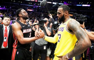 Miami Heat guard Dwyane Wade, left, shakes hands with Los Angeles Lakers' LeBron James at the end of an NBA basketball game Monday, Dec. 10, 2018, in Los Angeles. (AP Photo/Marcio Jose Sanchez)