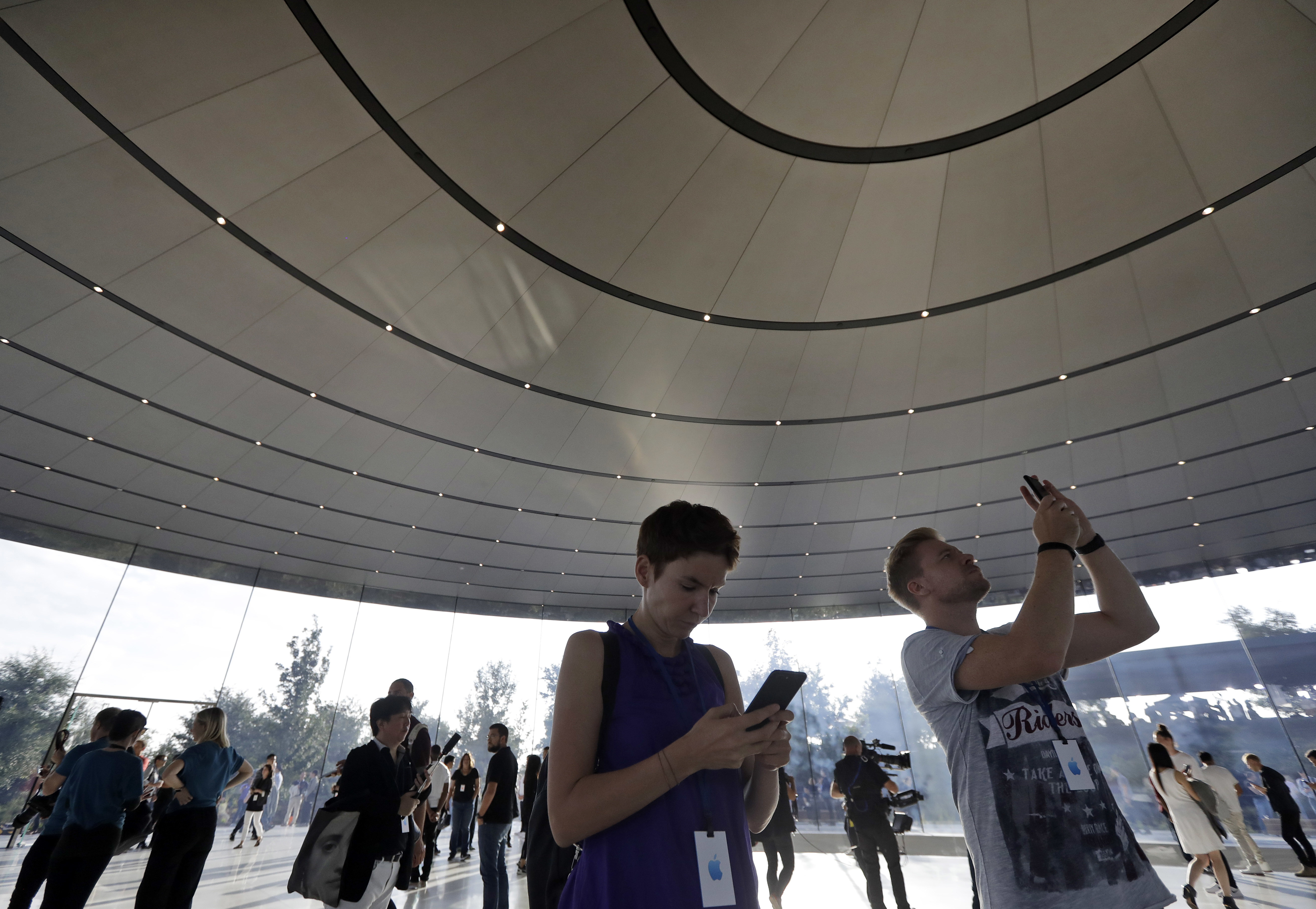 People arrive for a new product announcement at the Steve Jobs Theater on the new Apple campus, in Cupertino, Calif
Apple Event, Cupertino, USA - 12 Sep 2017