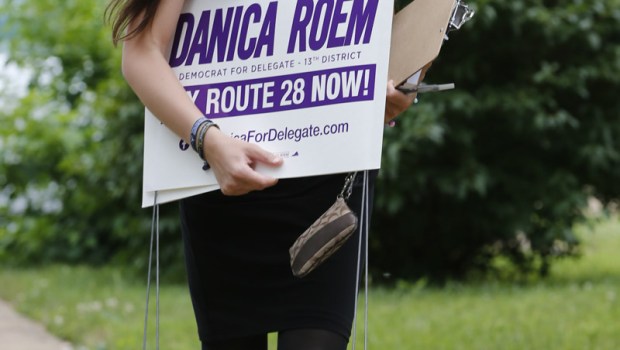 Democratic nominee for the House of Delegates 13th district seat, Danica Roem, brings campaign signs as she greets voters while canvasing a neighborhood, in Manassas, Va. Roem is running against Del. Bob Marshall in the 13th House of Delegates District
House Race Transgender Candidate, Manassas, USA - 21 Jun 2017