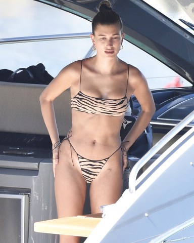 Sardinia, ITALY  - Hailey Baldwin and Bella Hadid throw on their bikinis and have some lunch while relaxing on a yacht in Sardinia. Hailey rocked a leopard print bikini while Bella sported a orange bikini.

Pictured: Hailey Baldwin

BACKGRID USA 23 JUNE 2020 

BYLINE MUST READ: CIAOPIX / FREZZA LAFATA / BACKGRID

USA: +1 310 798 9111 / usasales@backgrid.com

UK: +44 208 344 2007 / uksales@backgrid.com

*UK Clients - Pictures Containing Children
Please Pixelate Face Prior To Publication*