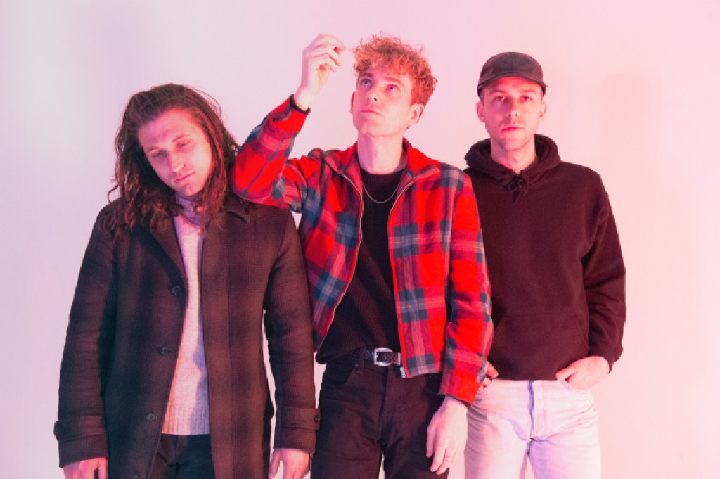 COIN stops by HollywoodLife.com to talk about their new single "Growing Pains" and 2018 tour.