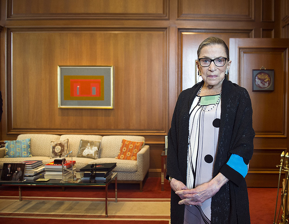 FILE - In this July 31, 2014, file photo, Associate Justice Ruth Bader Ginsburg in her Supreme Court chambers in Washington. In different circumstances, Ginsburg might be on a valedictory tour in her final months on the Supreme Court. But in the era of Donald Trump, the 84-year-old Ginsburg is packing her schedule and sending signals she intends to keep her seat on the bench for years. (AP Photo/Cliff Owen, File)