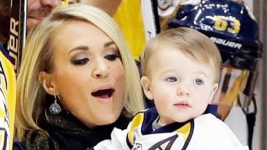 Mike Fisher, Carrie Underwood, Isaiah Fisher Nashville Predators forward Mike Fisher is honored for his 1,000th NHL hockey game before the first period of a game against the Los Angeles Kings, in Nashville, Tenn. With Fisher is his wife, singer Carrie Underwood, and their son, IsaiahKings Predators Hockey, Nashville, USA