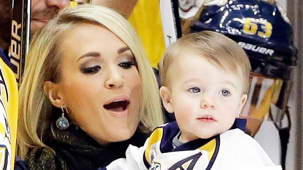 Mike Fisher, Carrie Underwood, Isaiah Fisher Nashville Predators forward Mike Fisher is honored for his 1,000th NHL hockey game before the first period of a game against the Los Angeles Kings, in Nashville, Tenn. With Fisher is his wife, singer Carrie Underwood, and their son, IsaiahKings Predators Hockey, Nashville, USA