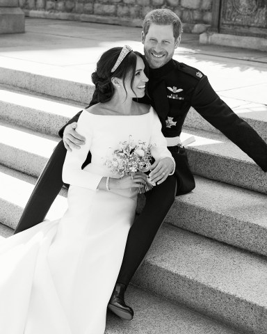 HANDOUT EDITORIAL USE ONLY/NO SALES
Mandatory Credit: Photo by Alexi Lubomirski/Kensington Palace/HANDOUT/EPA-EFE/REX/Shutterstock (9687906a)
Prince Harry and Meghan Markle
Official royal wedding photograph of Duke and Duchess of Sussex, Windsor, United Kingdom - 21 May 2018
A handout photo made available by Kensington Palace on 21 May 2018 of the official wedding photograph released by the Duke and Duchess of Sussex showing Britain's Prince Harry, Duke of Sussex and his wife Meghan, Duchess of Sussex on the East Terrace of Windsor Castle, in Winsor, Britain, 19 May 2018, after their royal wedding ceremony. 
NEWS EDITORIAL USE ONLY.  NO COMMERCIAL USE. NO MERCHANDISING, ADVERTISING, SOUVENIRS, MEMORABILIA or COLOURABLY SIMILAR. NOT FOR USE AFTER 31 DECEMBER 2018 WITHOUT PRIOR PERMISSION FROM KENSINGTON PALACE. NO CROPPING. Copyright in the photograph is vested in The Duke and Duchess of Sussex. Publications are asked to credit the photograph to Alexi Lubomirski. No charge should be made for the supply, release or publication of the photograph. The photograph must not be digitally enhanced, manipulated or modified in any manner or form and must include all of the individuals in the photograph when published.