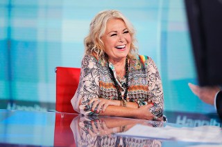 Roseanne Barr talks with Fox News talk show host Sean Hannity while being interviewed during a taping of his show, Thursday, July 26, 2018, in New York. The comedian and actress appeared on on the Fox News show "Hannity" on Thursday at 9 p.m. EDT for the first time since she was fired from ABC which canceled its successful reboot of "Roseanne" in May following the star's racist tweet likening former Obama adviser Valerie Jarrett to a cross between the Muslim Brotherhood and a "Planet of the Apes" actor. (AP Photo/Julie Jacobson)