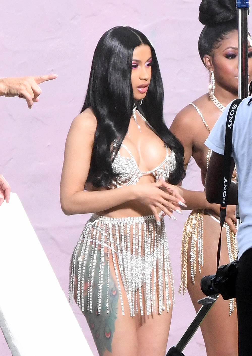 EXCLUSIVE: Cardi B. wears a very reveling rhinestone bikini, similar to one worn by rival Nikki Minaj, as she films a music video in Miami