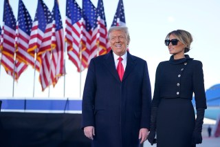 President Donald Trump and first lady Melania Trump greet the crowd before boarding Air Force One at Andrews Air Force Base, Md., Wednesday, Jan. 20, 2021.(AP Photo/Manuel Balce Ceneta)