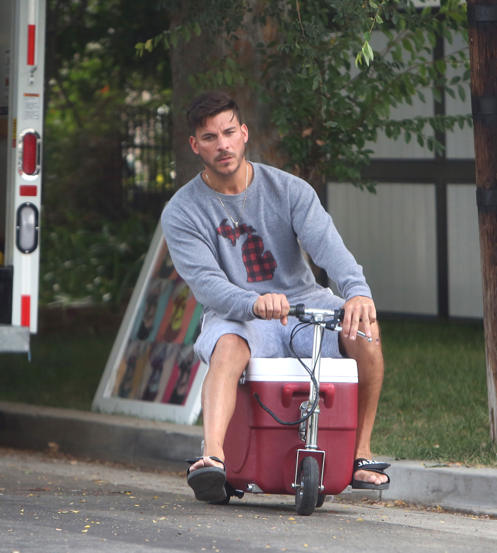 EXCLUSIVE: Jax Tayloris seen riding a customized ice chest scooter