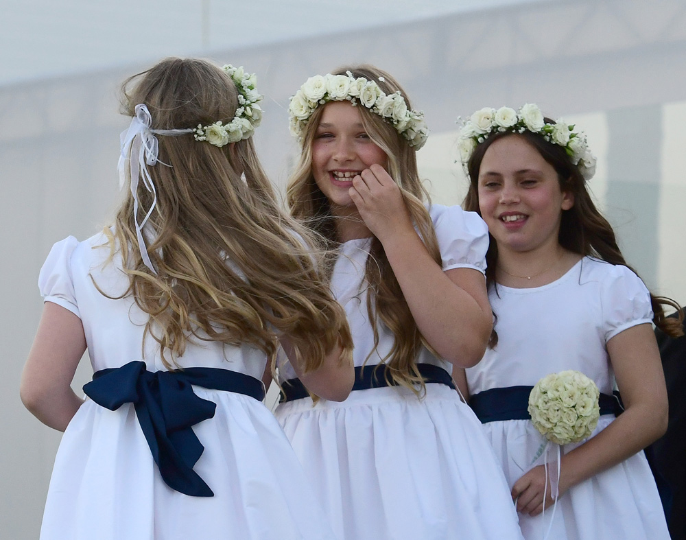 Harper Beckham is seen in her flower girl dress for her brother Brooklyn Beckham and Nicola Peltz wedding in Palm Beach