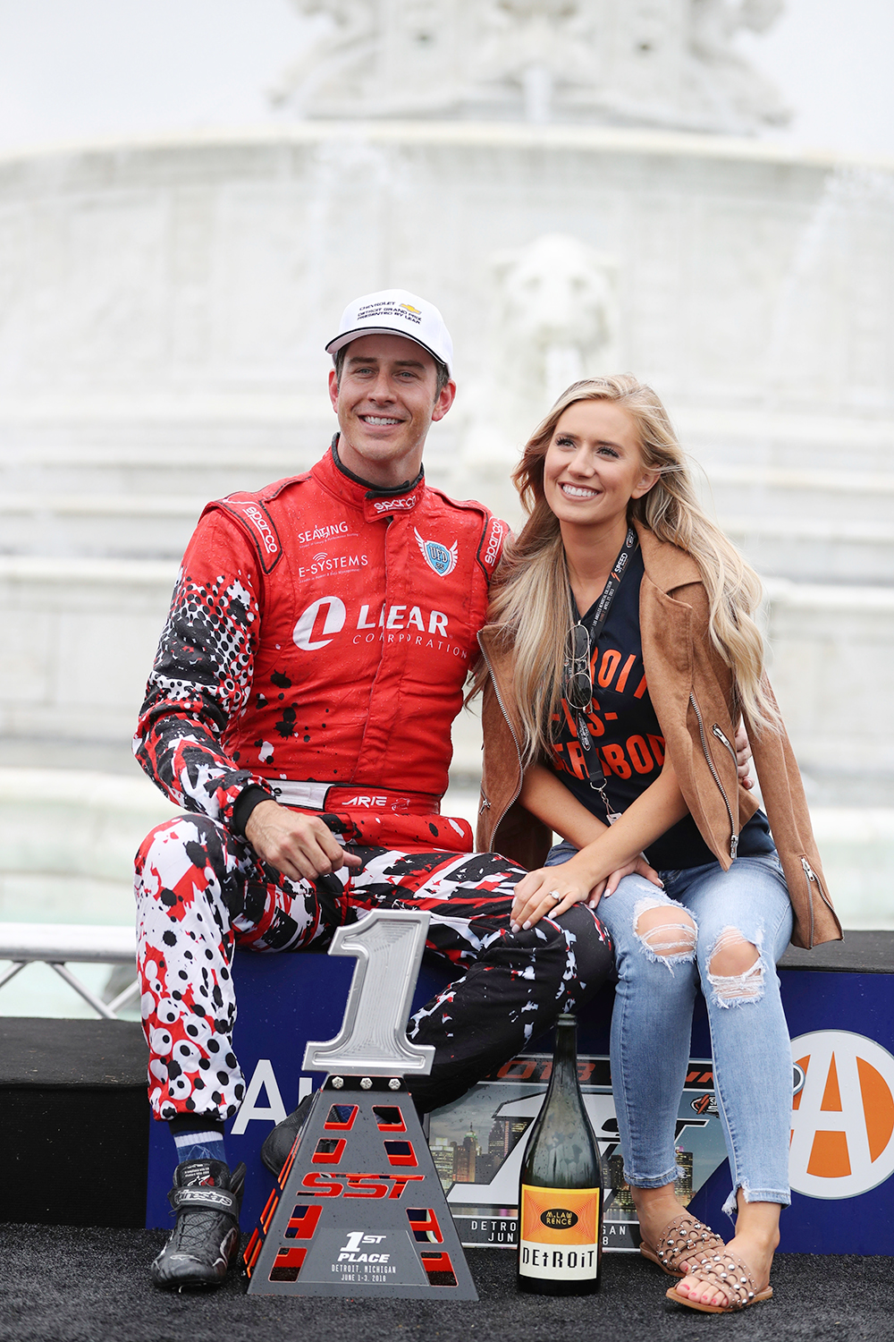 Arie Luyendyk Jr, Lauren Burnham. Arie Luyendyk Jr., and fiancee Lauren Burnham sit on the podium after Luyendyk won the Super Truck Series auto race, in DetroitIndyCar Auto Racing, Detroit, USA - 03 Jun 2018